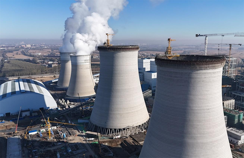 筑頂冰城暖源！國能哈熱二期項目3號排煙冷卻塔順利封頂